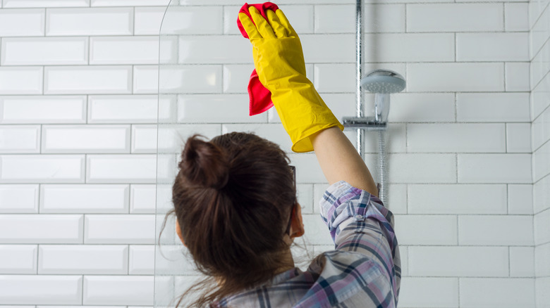 Woman cleaning shower