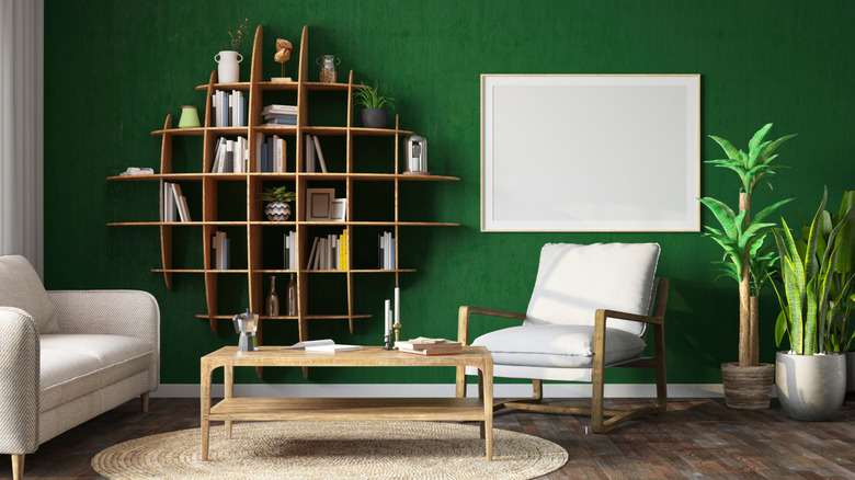 Green statement wall in living room