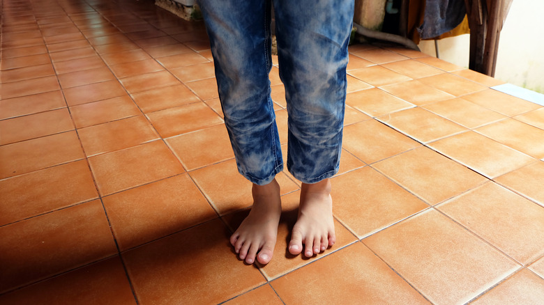 person walking barefeet on floors