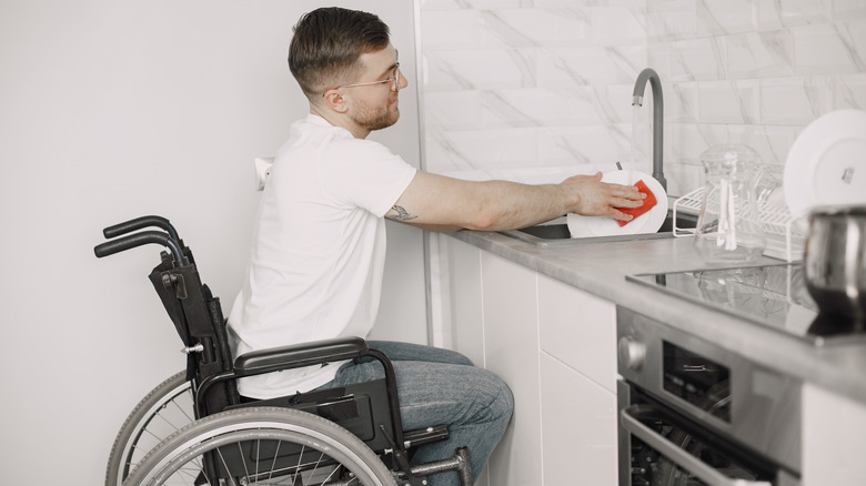 Man washing plates