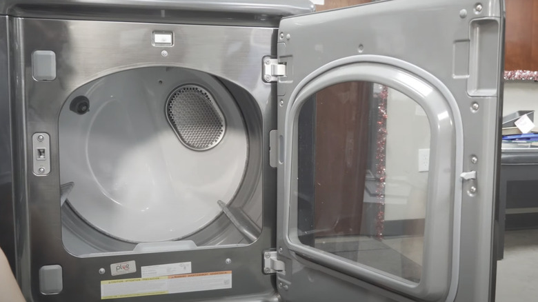 Open gray dryer with reversible door