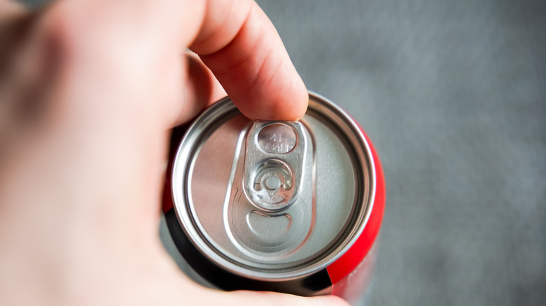 Opening can of cola 