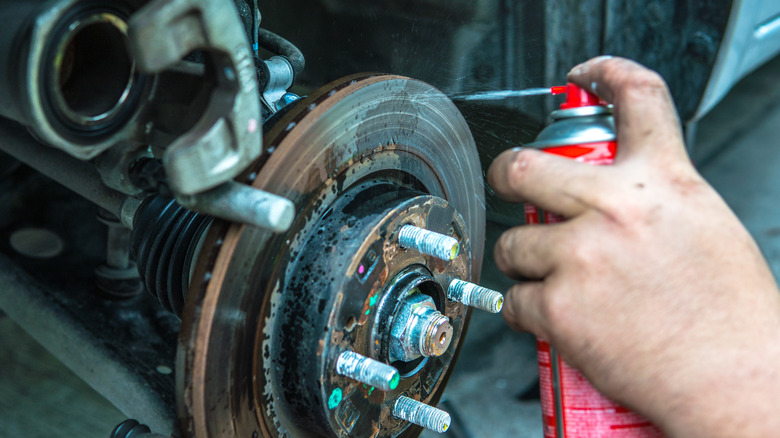 Spraying rusty car parts