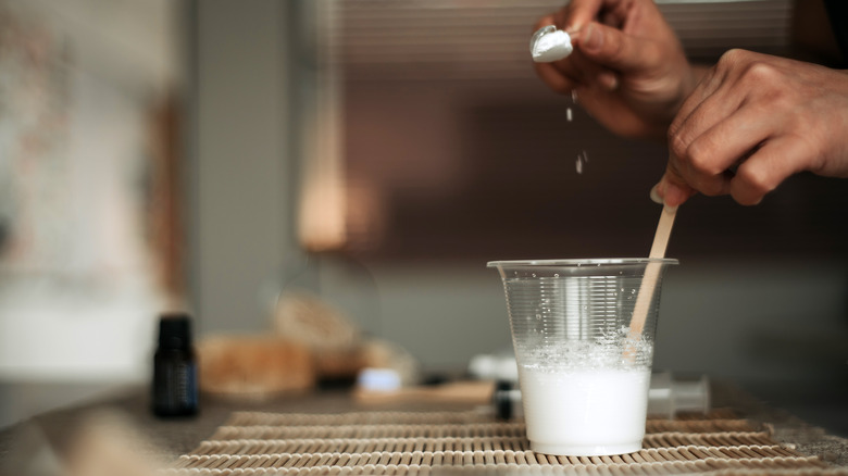 Person making baking soda paste