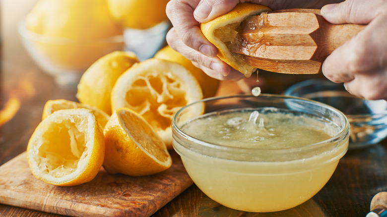 Squeezing fresh lemon juice