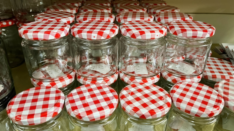 many Mason jars stacked up for sale