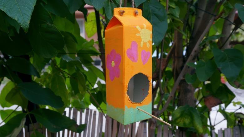 Milk carton bird feeder