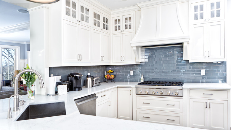 White laminated MDF cabinets in a kitchen