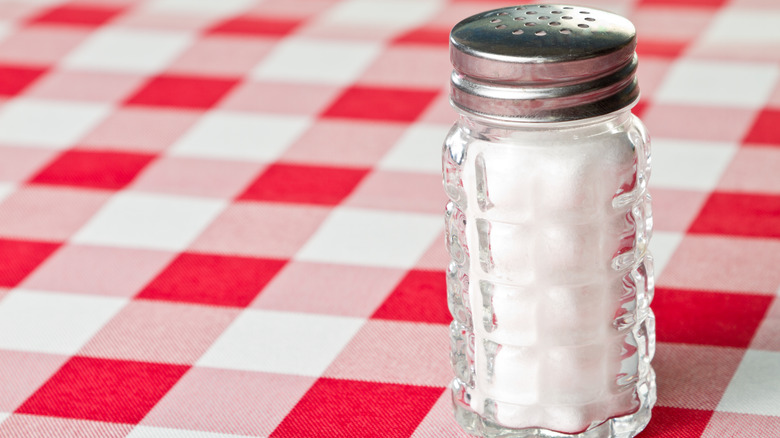 table salt on checkered table cloth