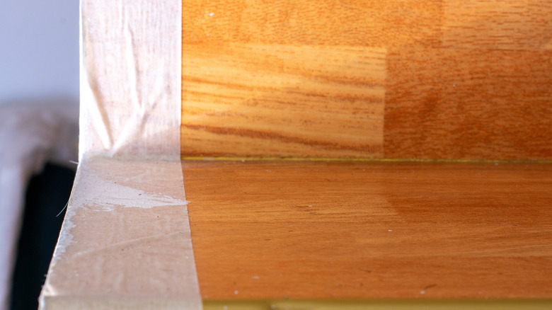 Wrinkled masking tape on wood furniture