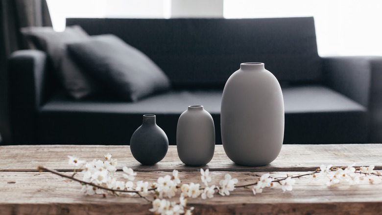 dark sofa and vases