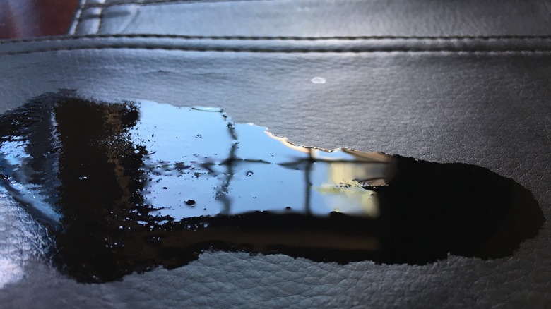 liquid spilled on black leather