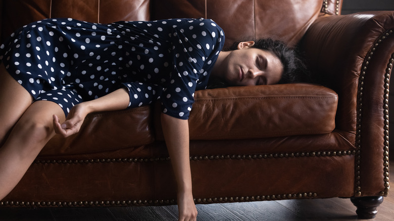 Woman sleeping on couch