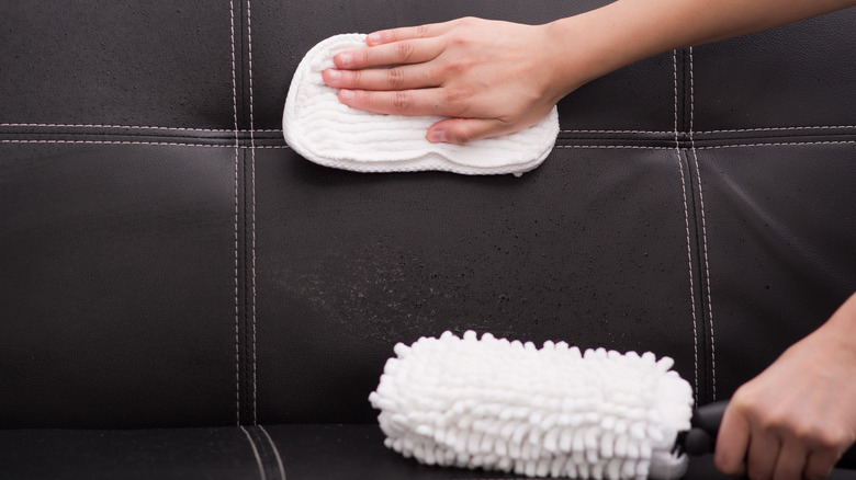 White scrub on black couch