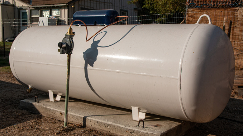 A propane tank in a yard