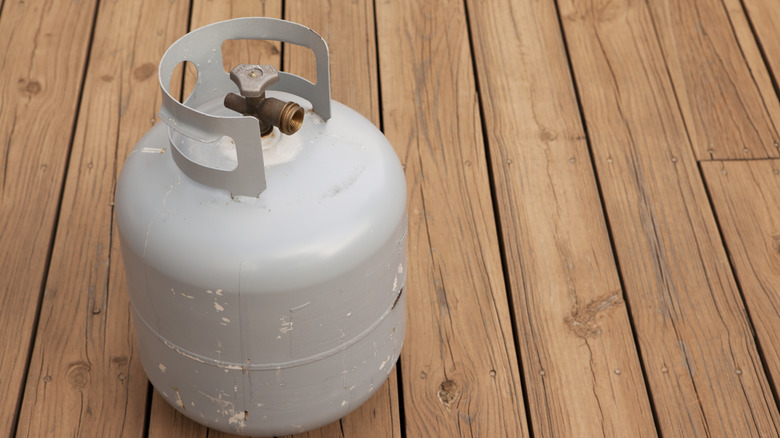 A propane tank on a deck