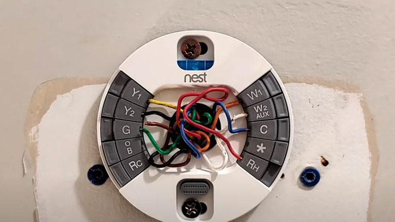 View of a Nest thermostat mounting plate and wiring