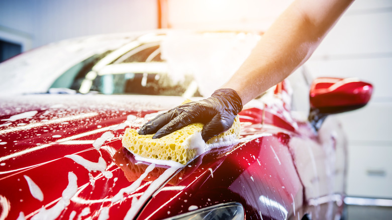 person washing car