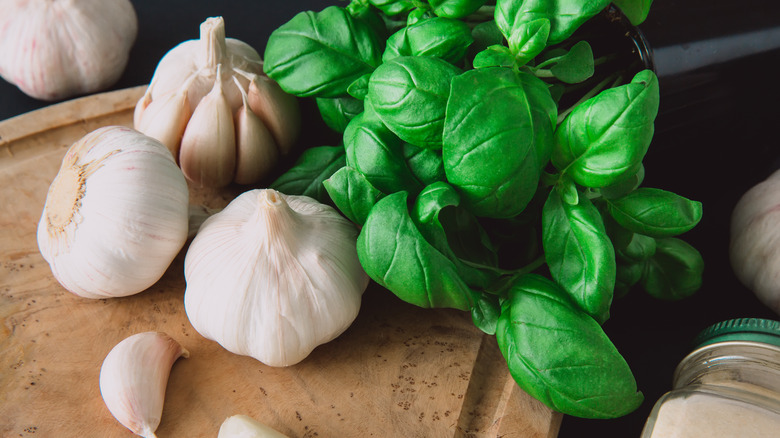 Garlic and basil on board 