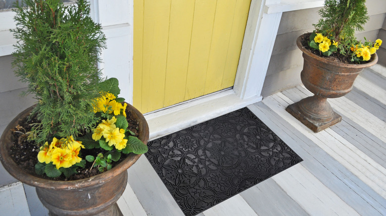 home with outdoor rubber mat on porch