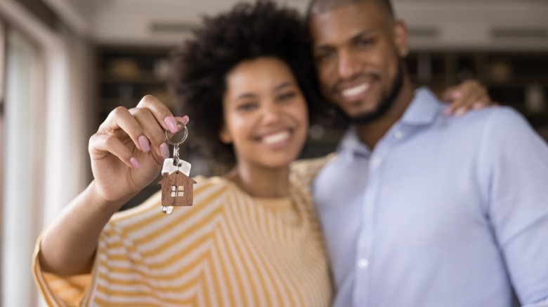 Young couple getting mortgage loan 