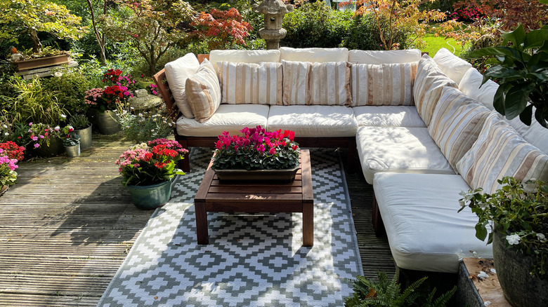 Sofa on deck with rug