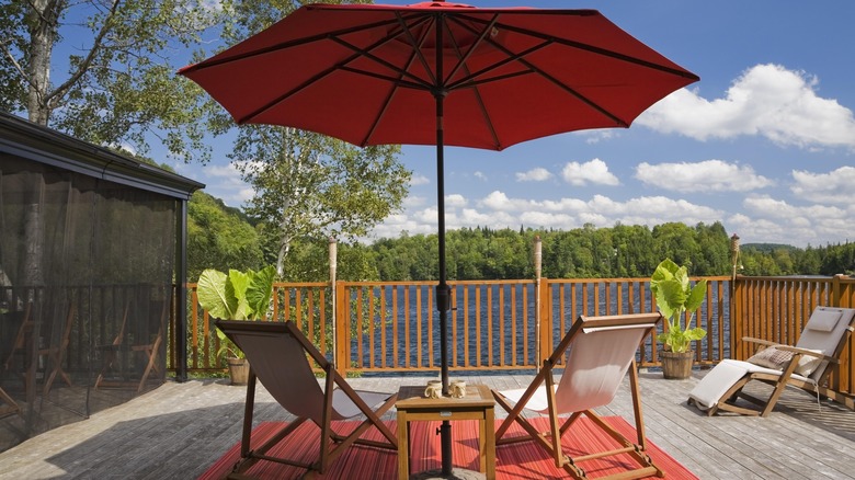 Deck with rug and umbrella