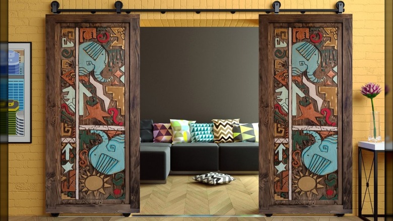 Custom barn doors with hand-crafted elephant pattern