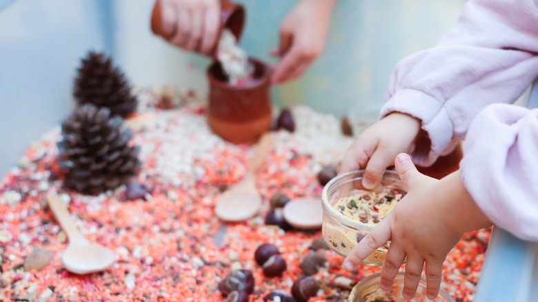 Kids playing in sensory bin