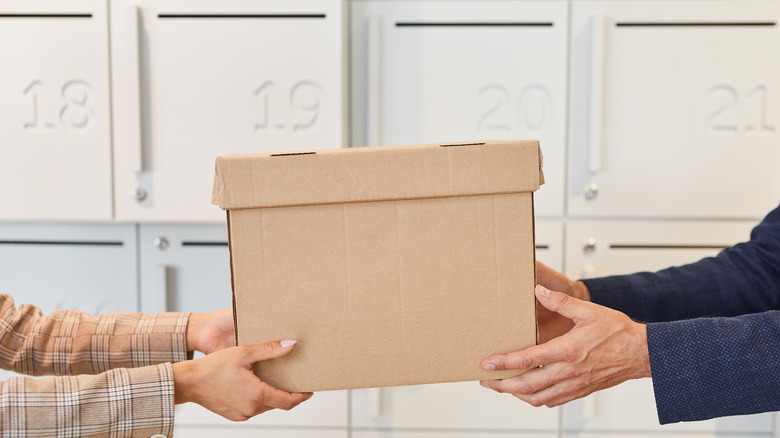 People holding a box