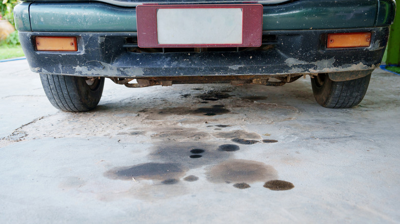 oil stain on driveway under car