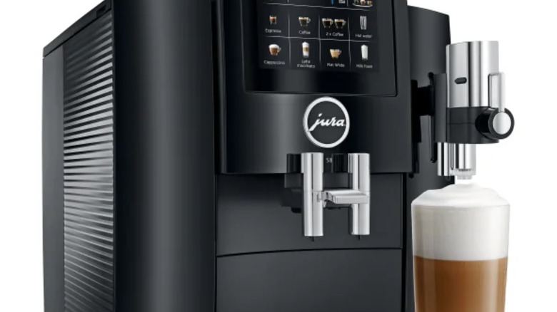 The Jura S8 coffee maker making a latte with cream