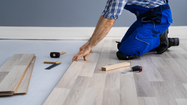 Man installing new flooring