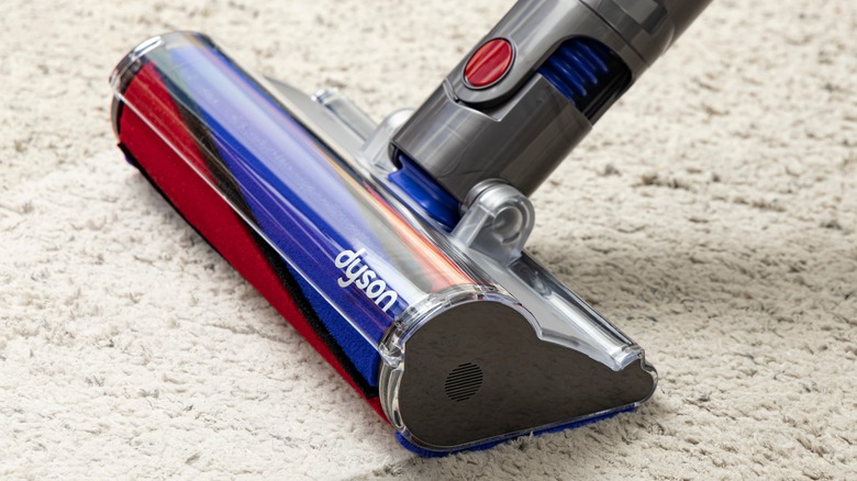 Dyson vacuum cleaning a carpet