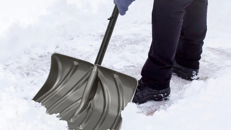 Man shoveling snow with a Suncast snow shovel