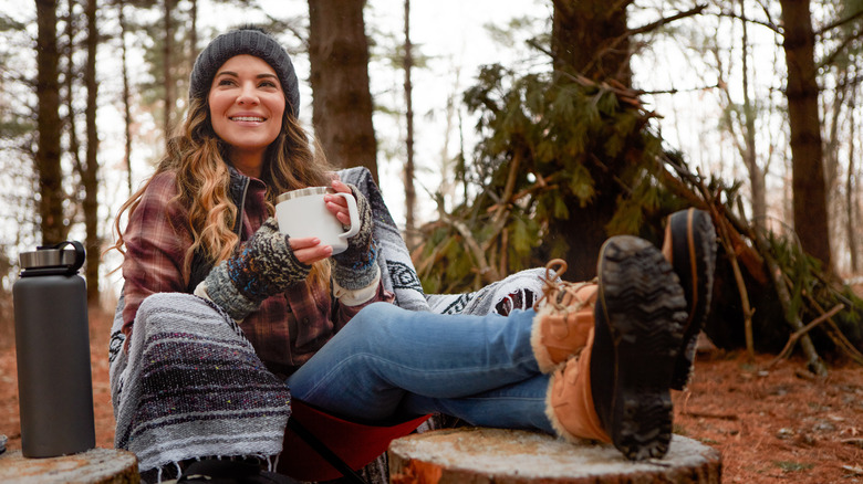 woman in chair outdoors smiling