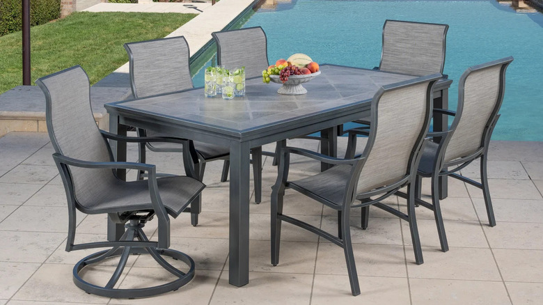 Contemporary gray outdoor chairs and tiled porcelain table set