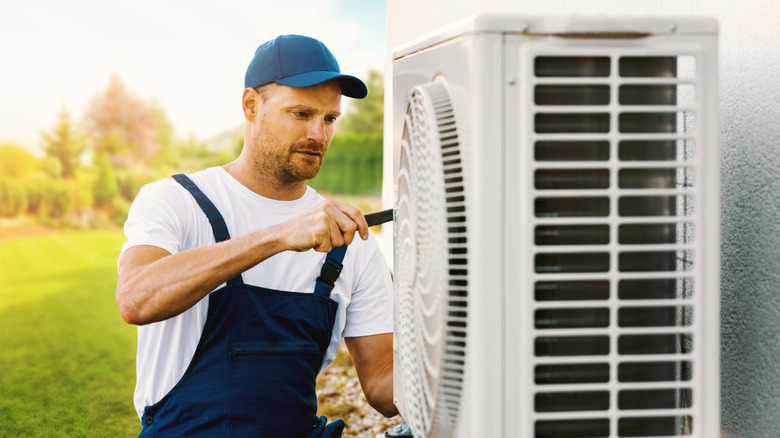 A technician servicing an HVAC unit