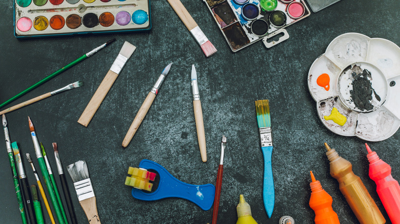 Paint, paintbrushes, and other art supplies