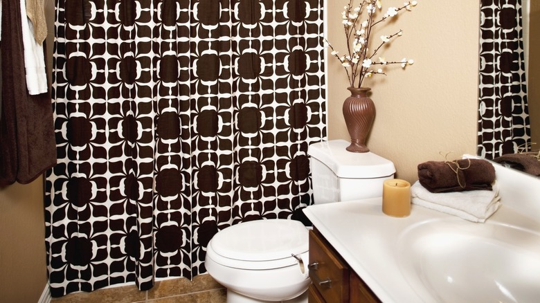 Brown and white patterned shower curtain in bathroom