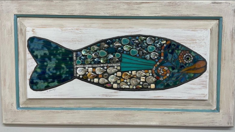 fish mosaic artwork on cabinet