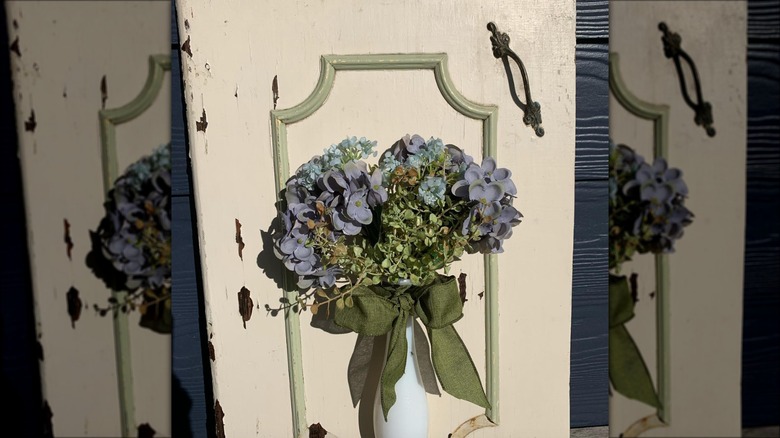 hydrangeas in cabinet wall vase