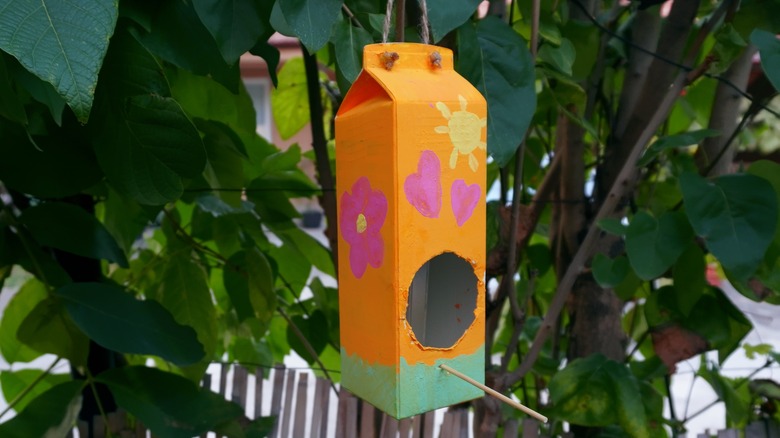 Milk carton bird feeder