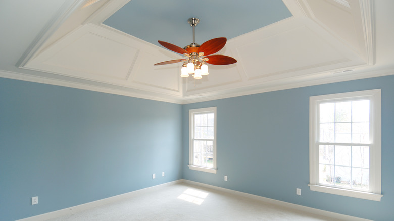 empty room with blue ceiling and walls