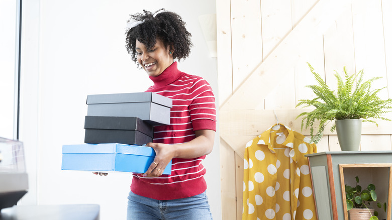 woman with shoeboxes