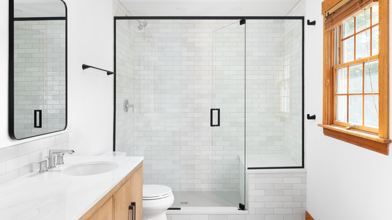 Shower with subway tiles in a running bond pattern