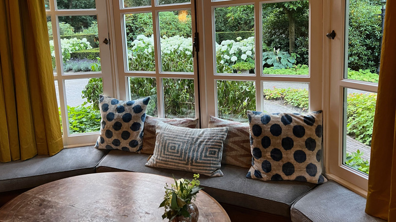 Bay window seat looking out into a garden