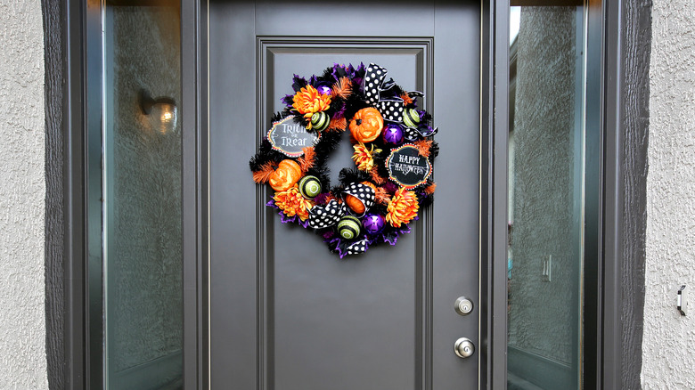 black door with halloween wreath