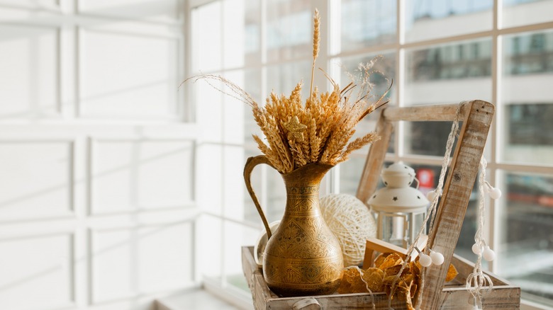 Dried wheat in pitcher vase