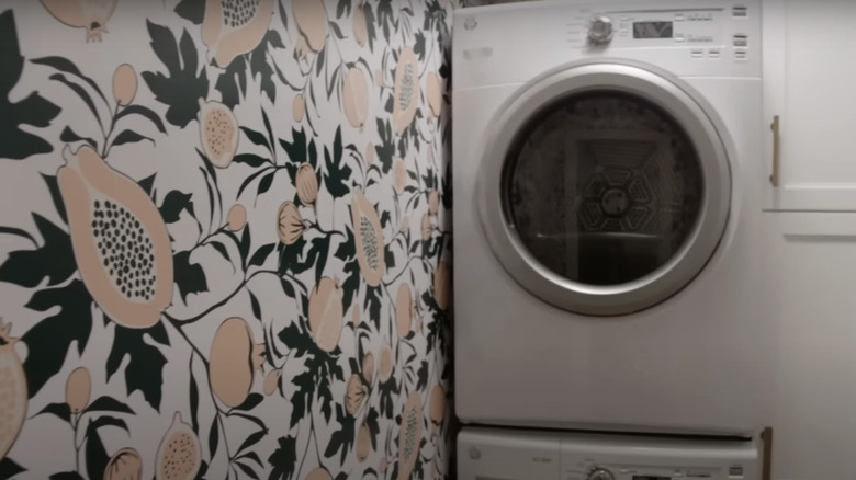 patterned wallpaper in laundry room